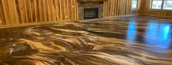 This image shows a living room with an epoxy floor.
