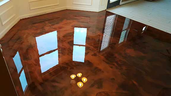This image shows a metallic epoxy floor that is very shiny.